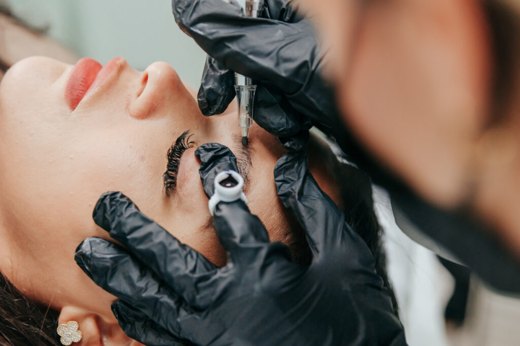 Close up of a woman getting her eyebrows done with permanent makeup near Palm Beach